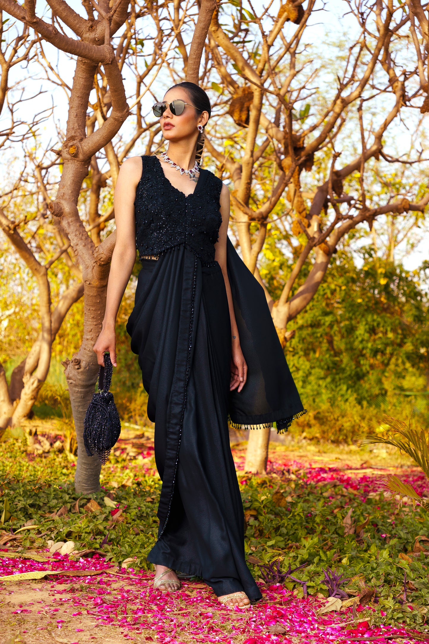 Black Dori & Sequence work Blouse paired with a Shimmer Stitched Saree